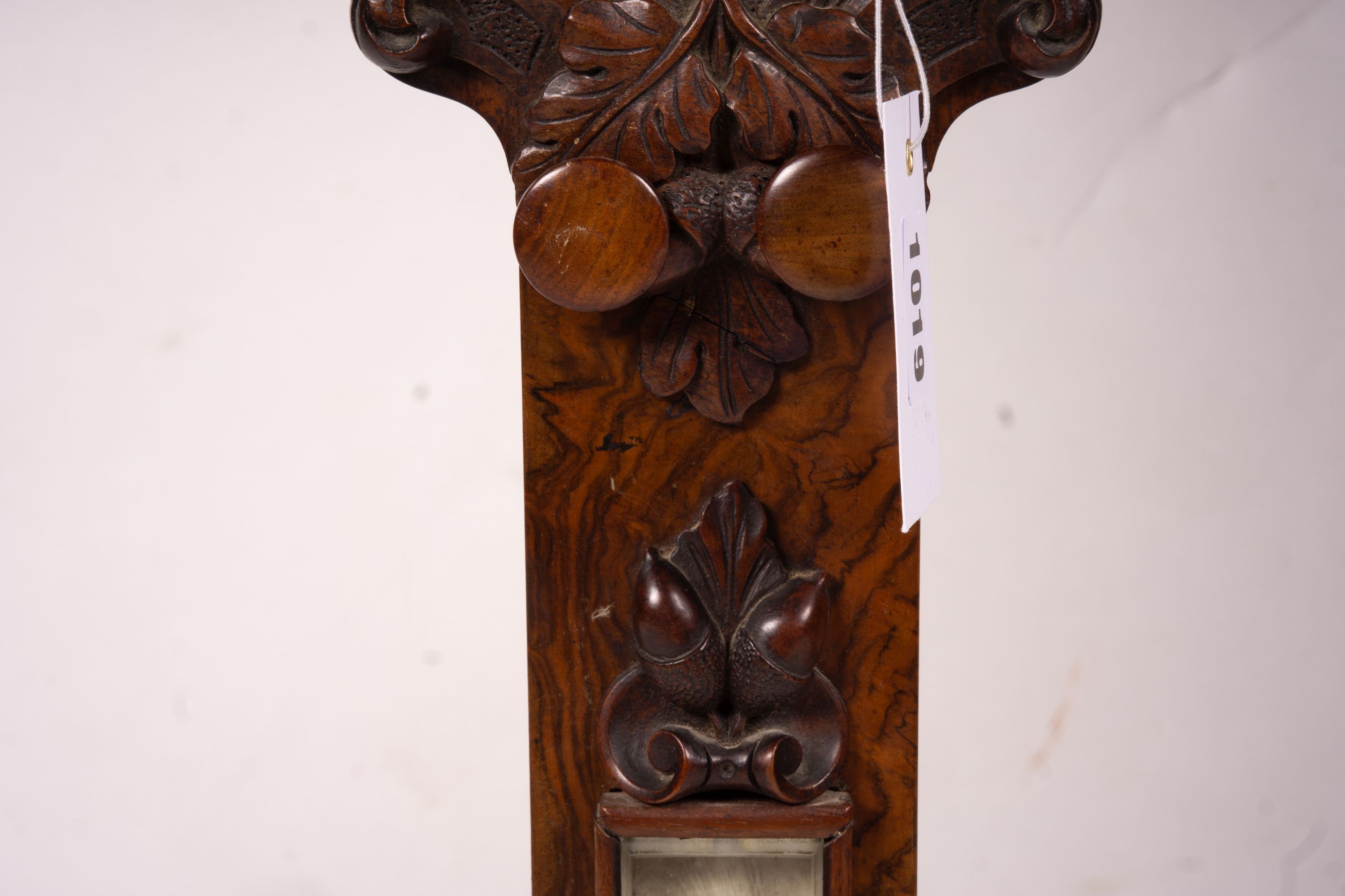 A Victorian carved walnut stick barometer by Chadburn Bros., Sheffield, height 104cm